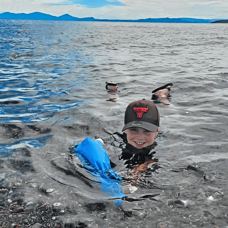 Tracey's son at the lake wearing his full arm waterproof protector