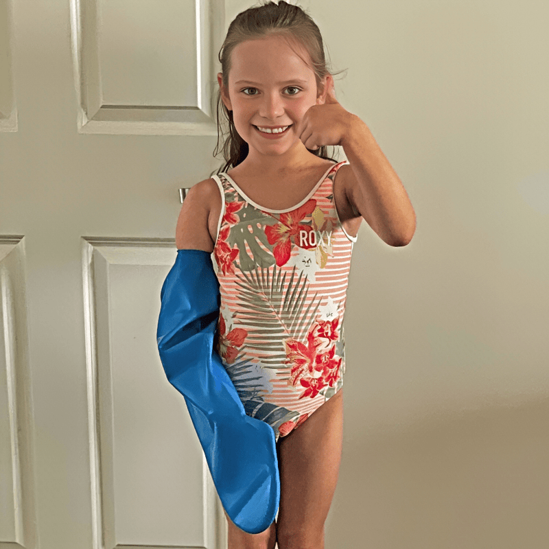 Vania's daughter wearing her full arm waterproof protector