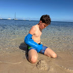 Rexs son wearing waterproof arm cast cover on holiday in fiji