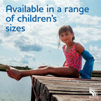 girl sitting on a jetty wearing a full arm cast cover