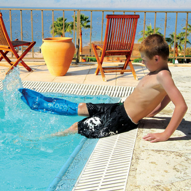 Boy wearing waterproof short leg cover at swimming pool
