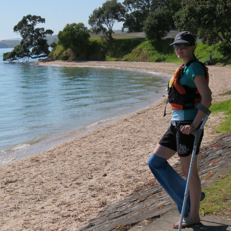 Dani at beach wearing bloccs short leg cast cover