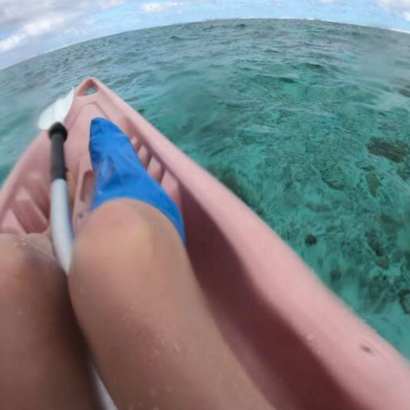 Jess kayaking in her short leg cast cover in rarotonga