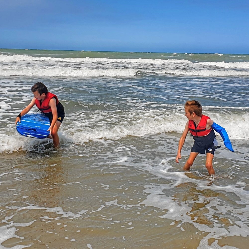 Lyndsey's son swimming with his full arm waterproof protector
