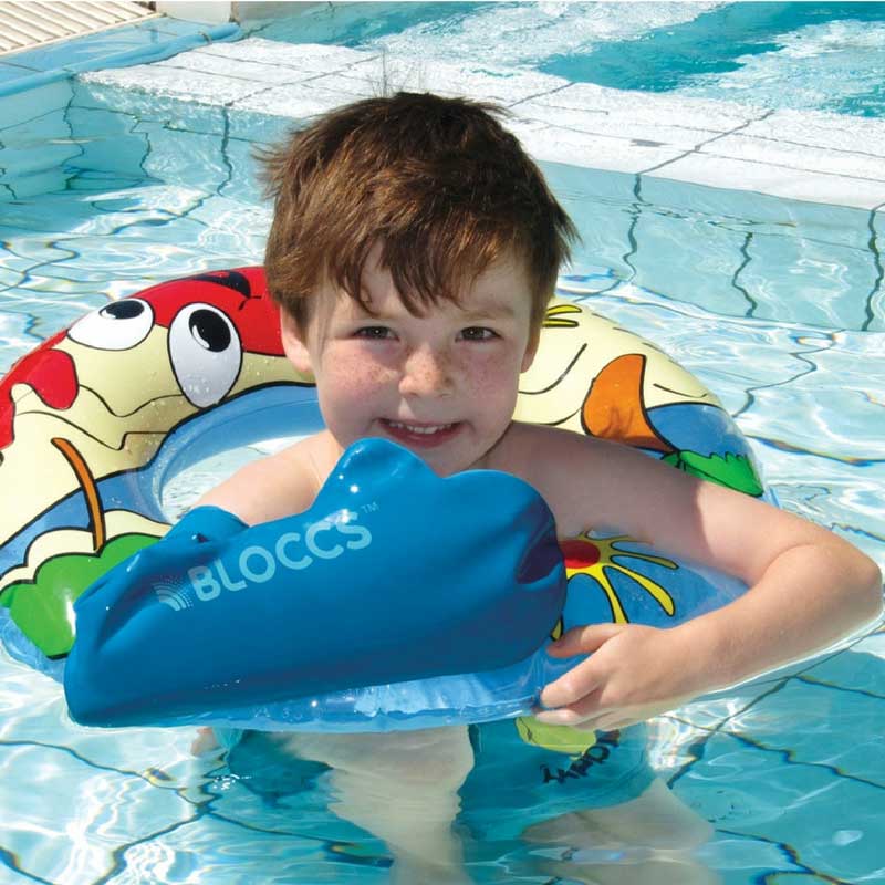 Boy wearing waterproof arm cast protector for swimming